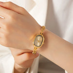 Helena® - Elegant Gold Watch Featuring an Oval Dial and Sleek Black Frame – view 2