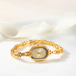 Helena® - Elegant Gold Watch Featuring an Oval Dial and Sleek Black Frame – view 3